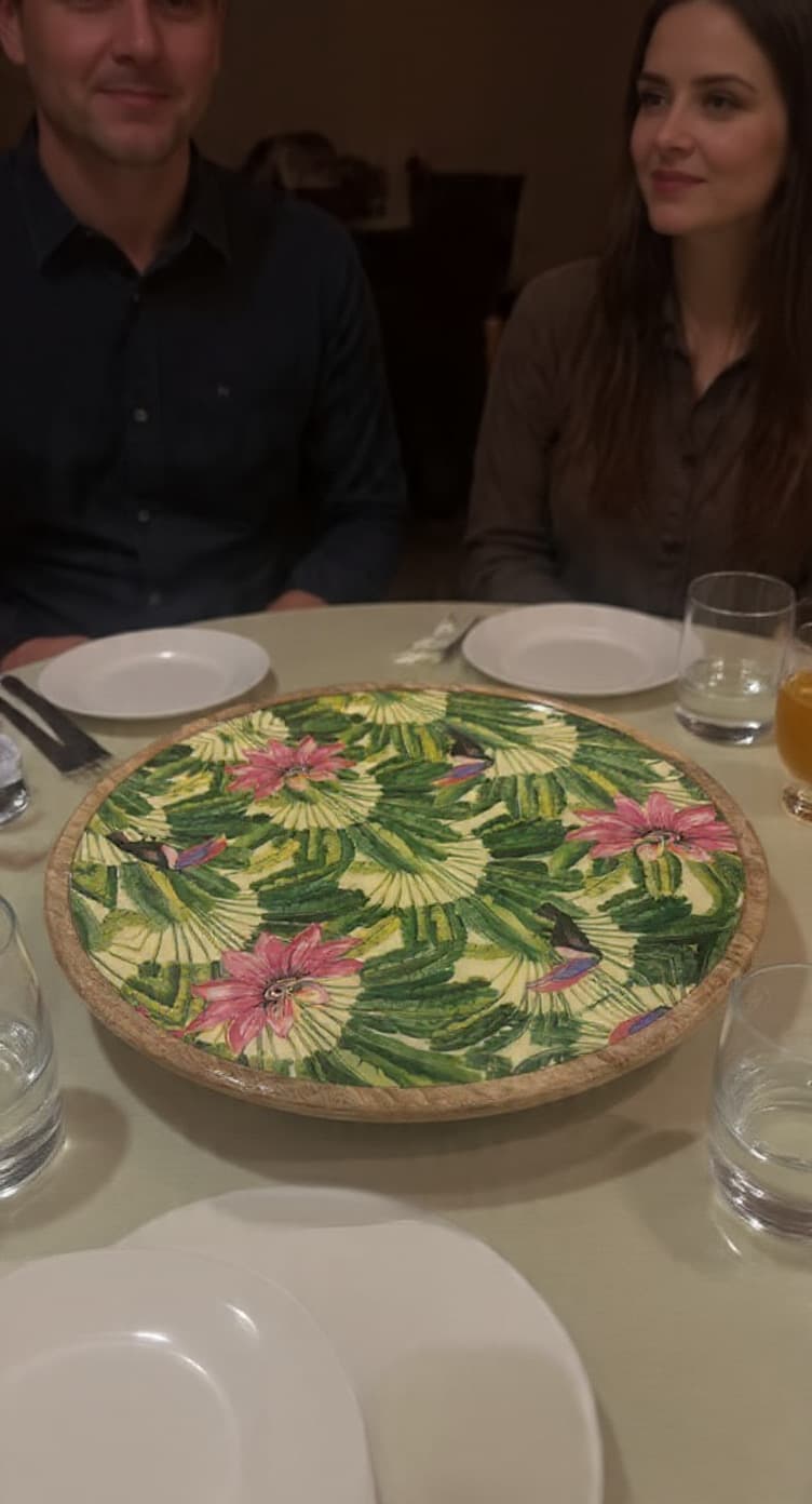 Tropical hummingbird enamel platter on dining table with couple