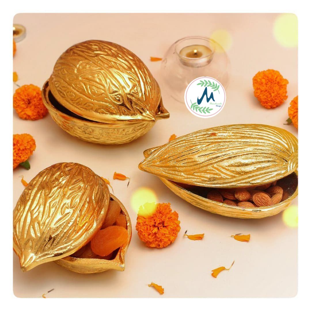 Three gold walnut and almond dry fruit boxes open with apricots and almonds