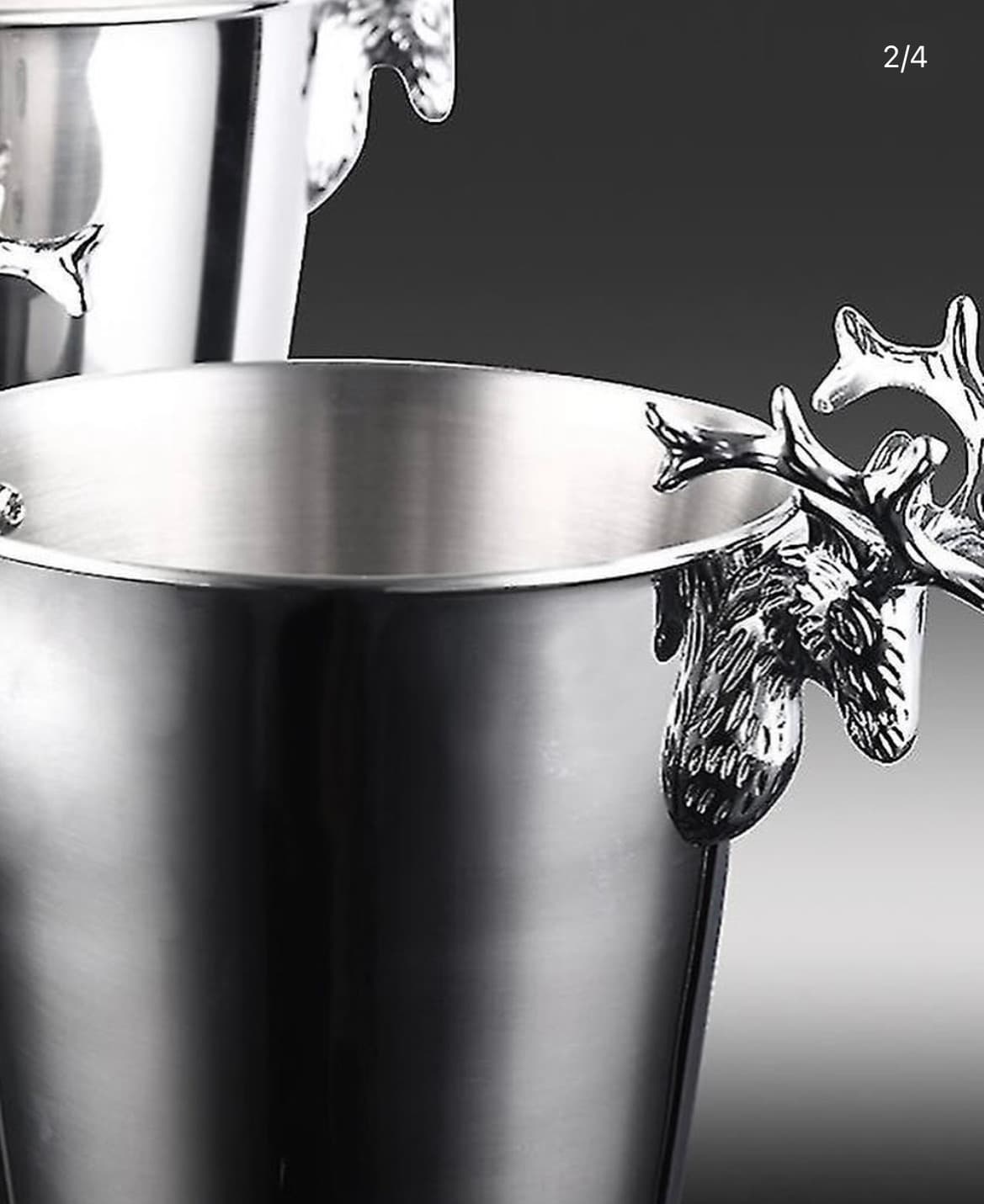 Close-up detail of sculpted deer antler handle on stainless steel bucket