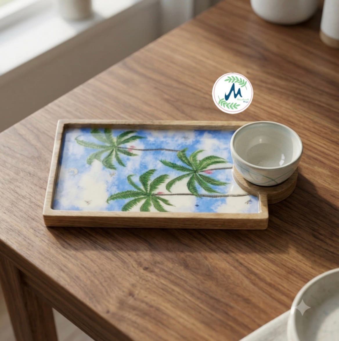 Palm tree enamel serving tray on wooden table with tea cup