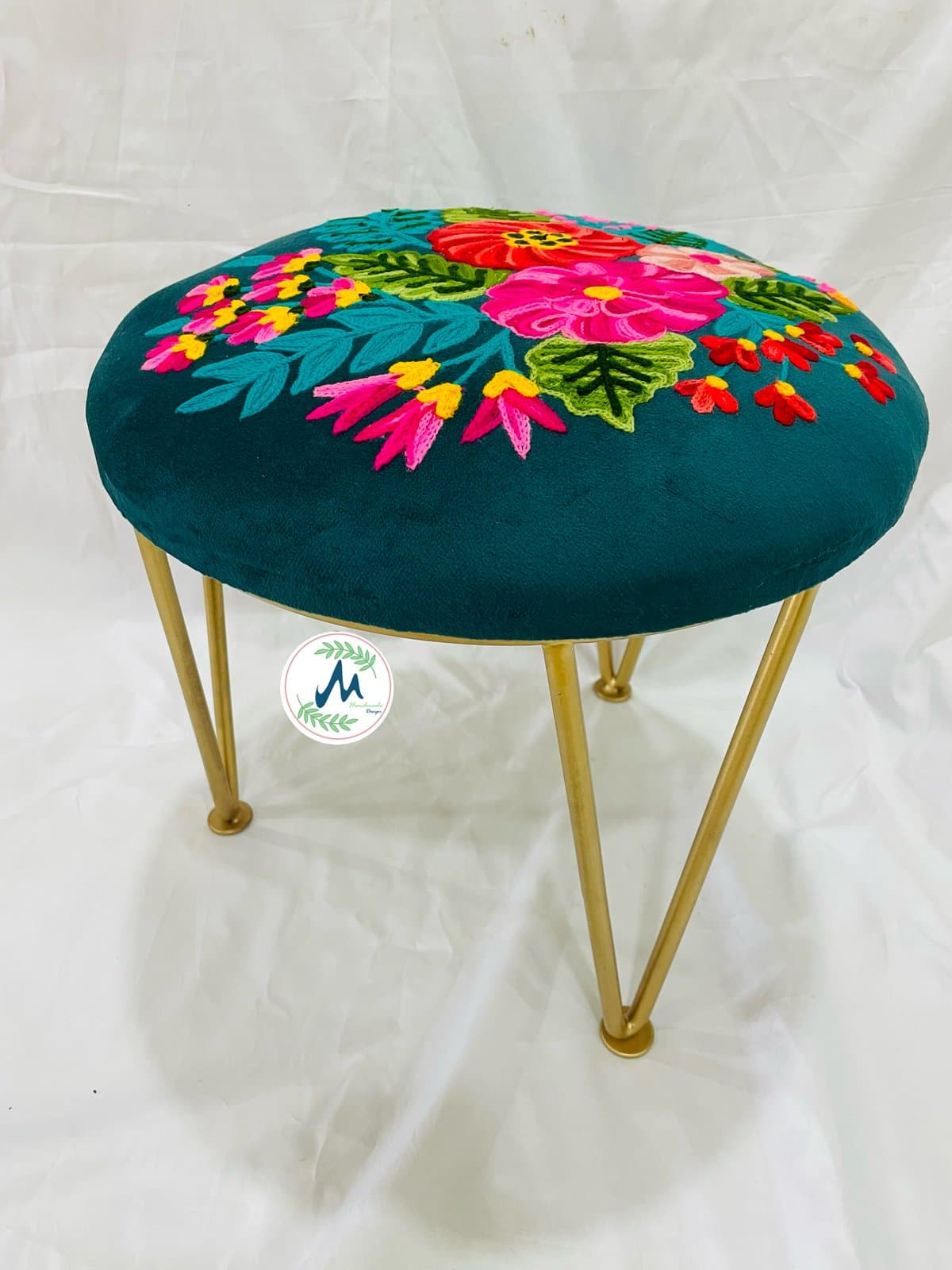 Teal velvet embroidered stool with brass hairpin legs