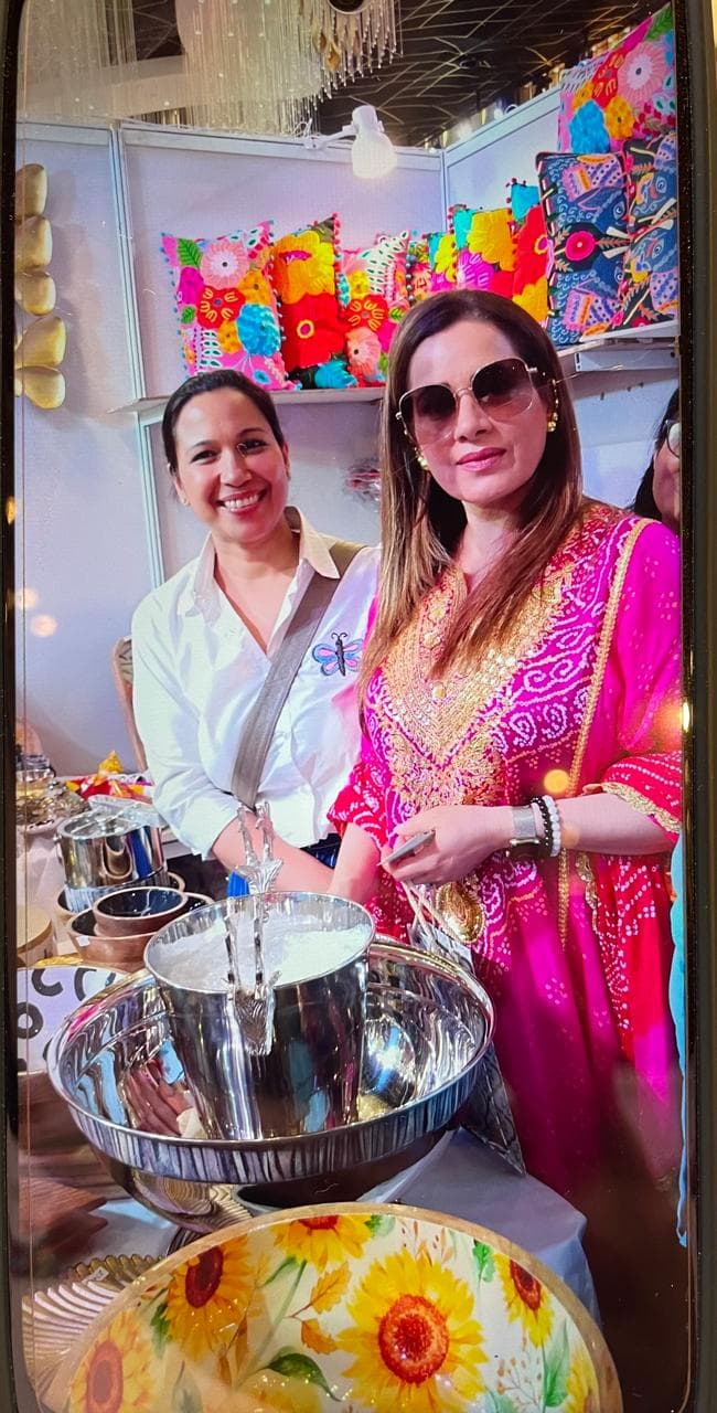 Celebrity guest admiring handcrafted brass champagne bowl